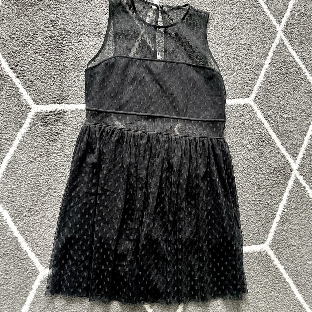 Black dress with see through cut outs and black shorts underneath